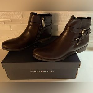 Brown ankle boot with gold hardware.